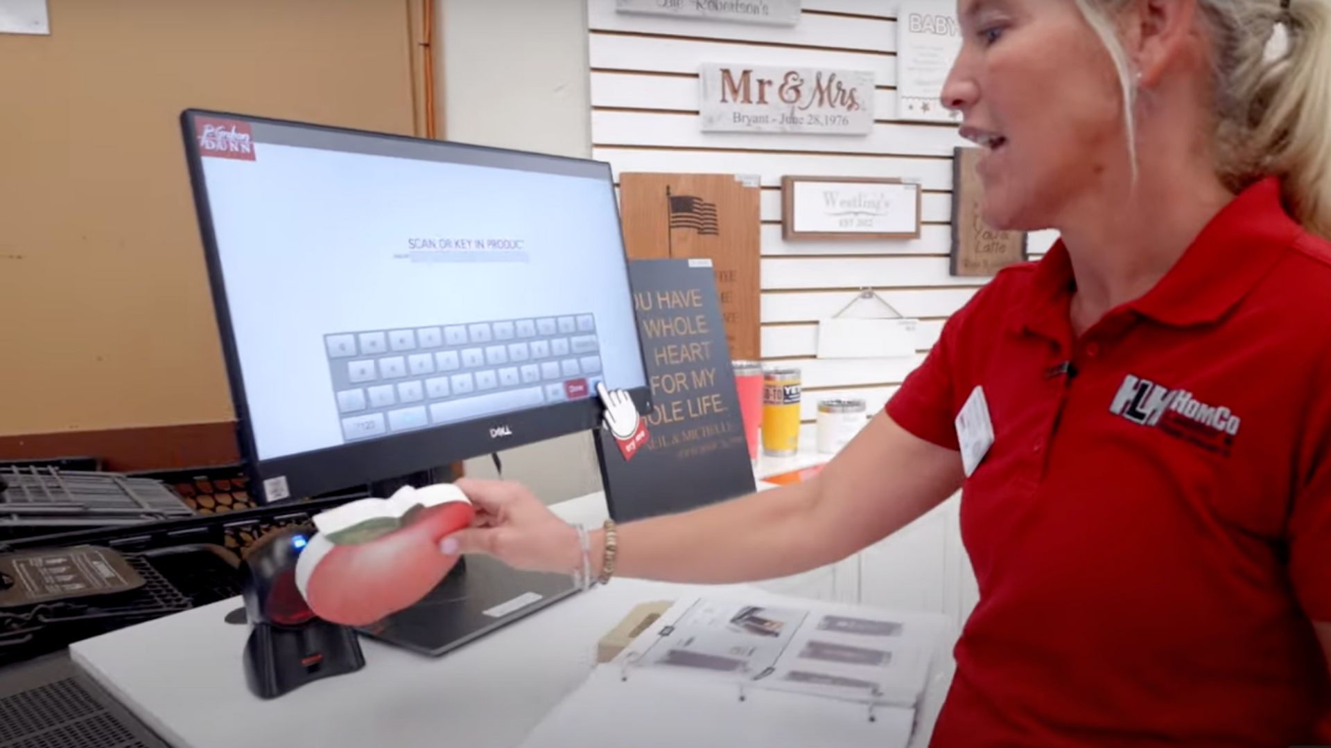 homco team member scanning item into engraving machine